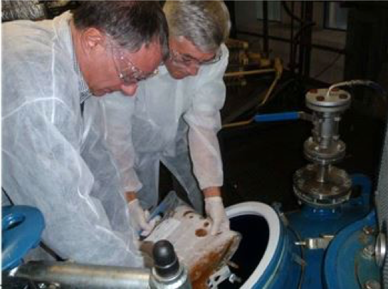 Revival and amplification – Dr. Sławomir Falkowicz from INiG and Phillip Launt from RAM Bio are shown seeding a reactor with microbial materials at INiG’s fermentation facility.